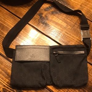 A Gucci black canvas waist belt purse.